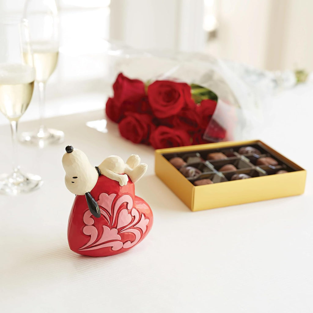 Enesco Peanuts by Jim Shore Snoopy Laying on Heart Figurine I28696