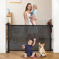 Extra-Wide Retractable Baby & Pet Gate - 31" Tall, Extends up to 71" Wide, Easy One-Hand Operation, Family Choice Award Winner, Safe for Kids & Pets, Indoor & Outdoor, Black